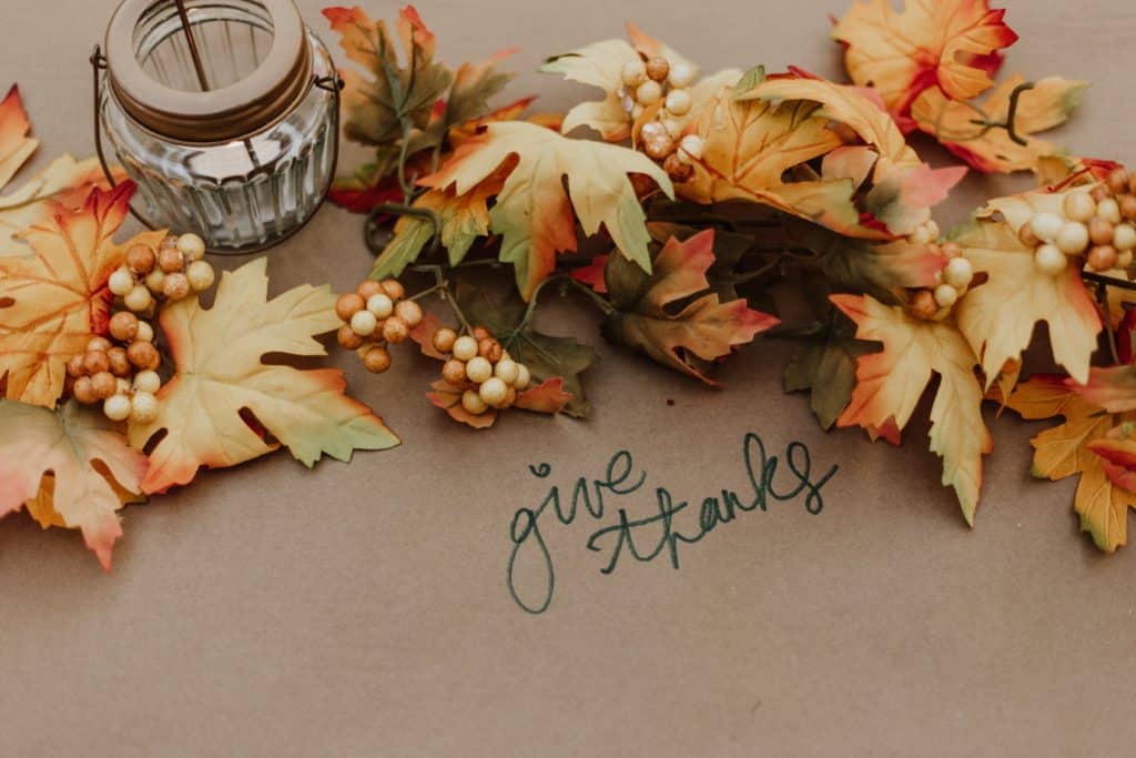 leaves-on-brown-paper-with-candle-tablespread-priscilla-du-preez